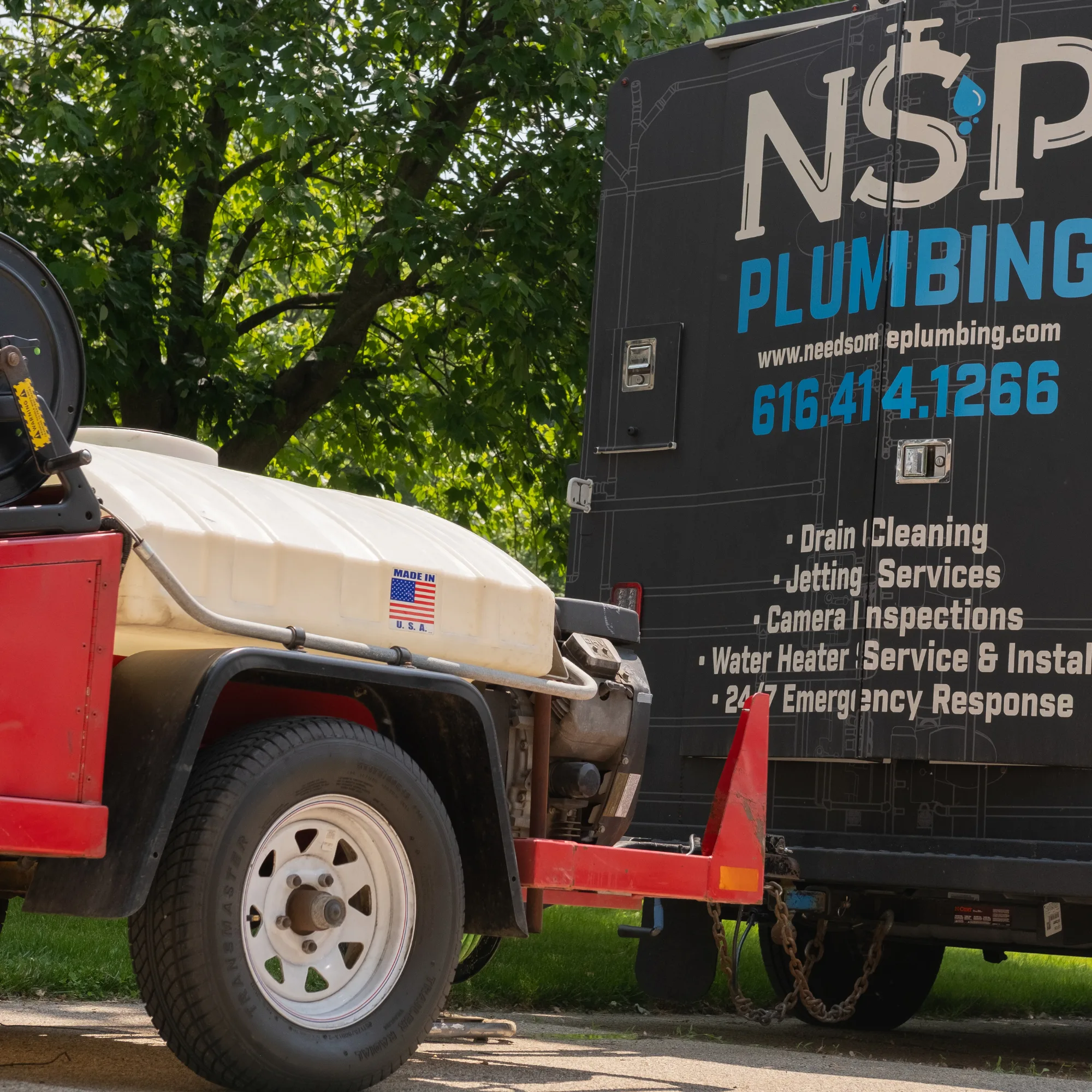 High-pressure hydro jetting equipment clearing a residential sewer line in Grand Rapids, Michigan.